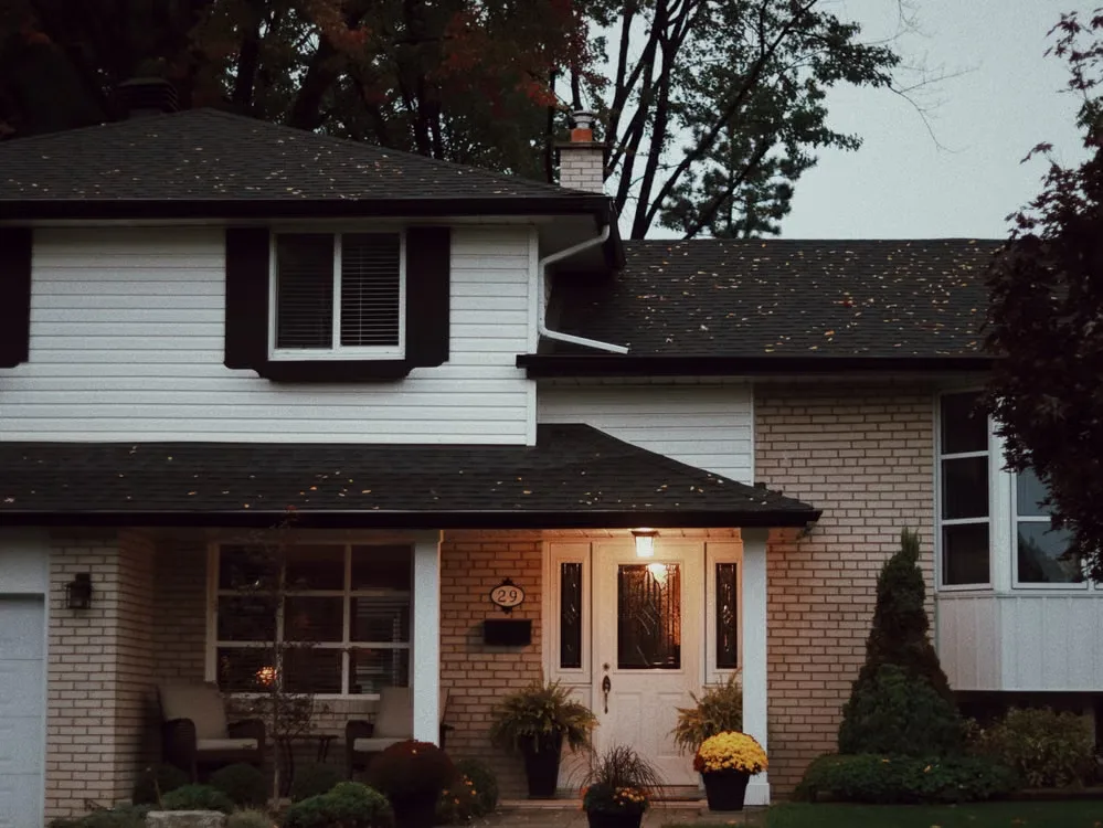 Front facade of a house with weathered asphalt shingles